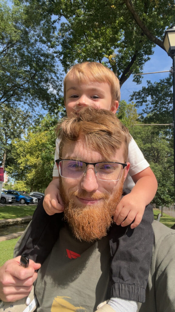 Caleb Francis with his son Emersyn on his shoulders